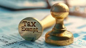 A golden tax exempt stamp on financial papers, highlighting a visual guide to resale certificates explained.